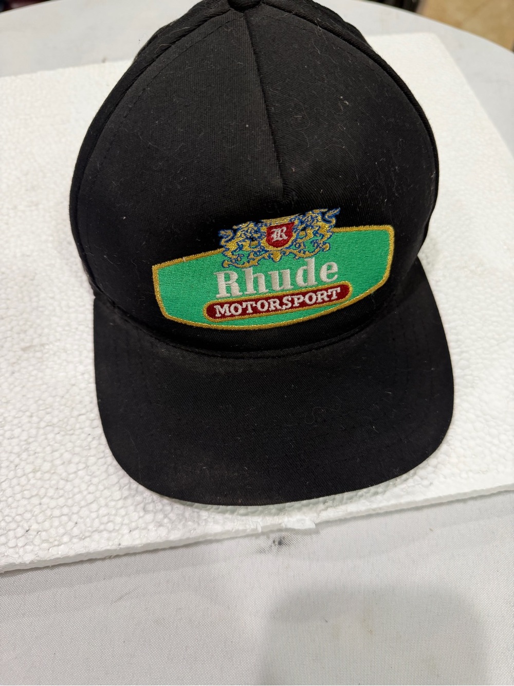 Rhude Black Cap with Green and Gold Motorsport Crest